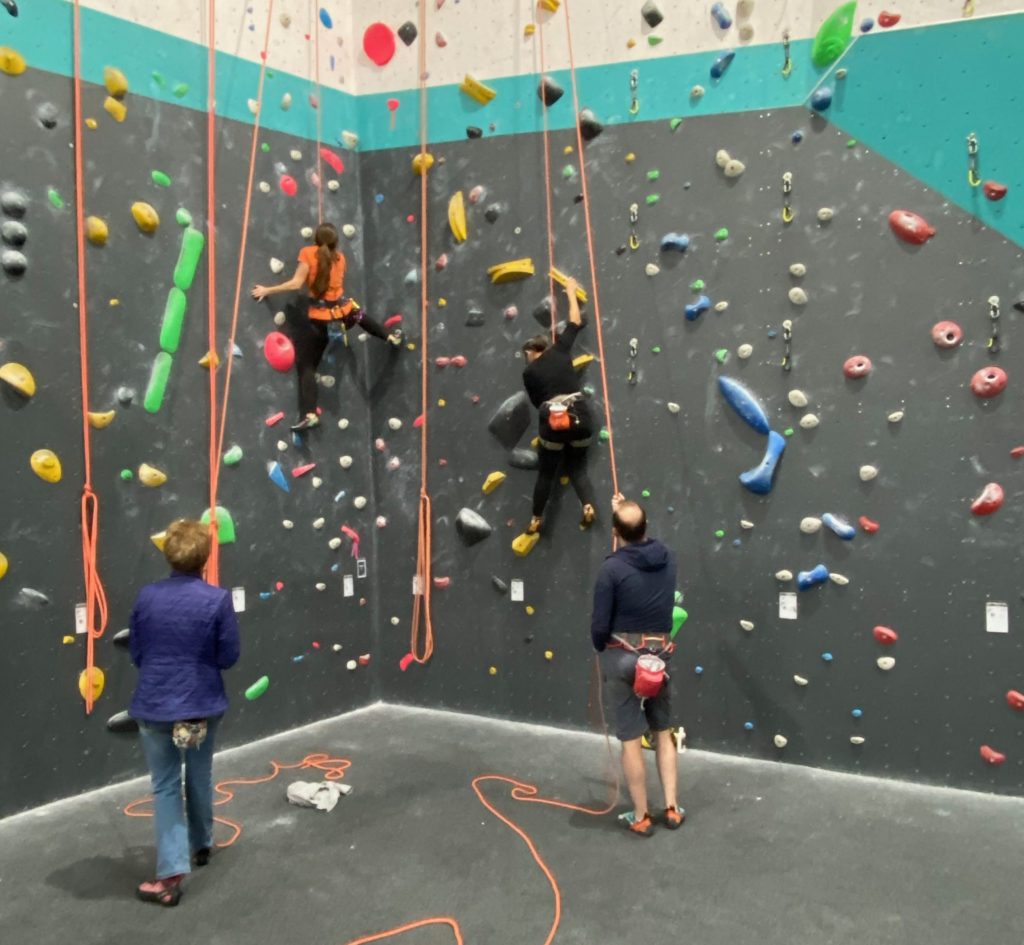 Climbers on top rope climbs at the gym - Jurassic Climbing, Dorset